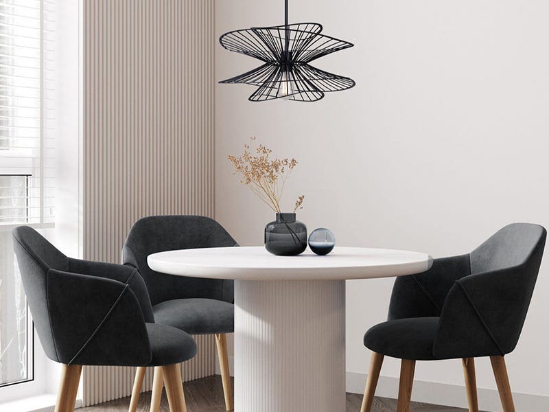 Modern dining nook with sculptural black pendant ceiling light