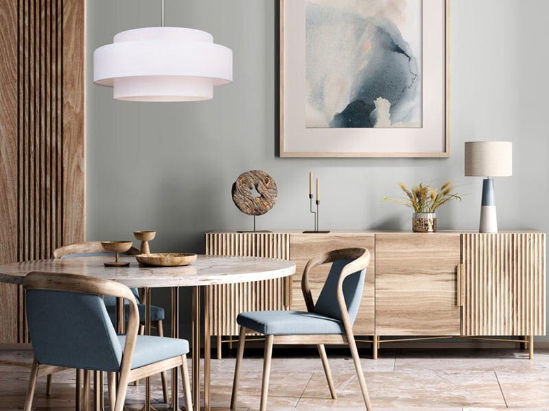 Dining room with layered white pendant ceiling light above round table