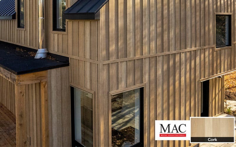 A house exterior featuring natural wood siding, showcasing a warm and inviting architectural style.
