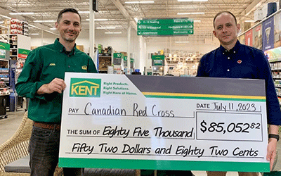 KENT Store associates present a large check to the Canadian Red Cross